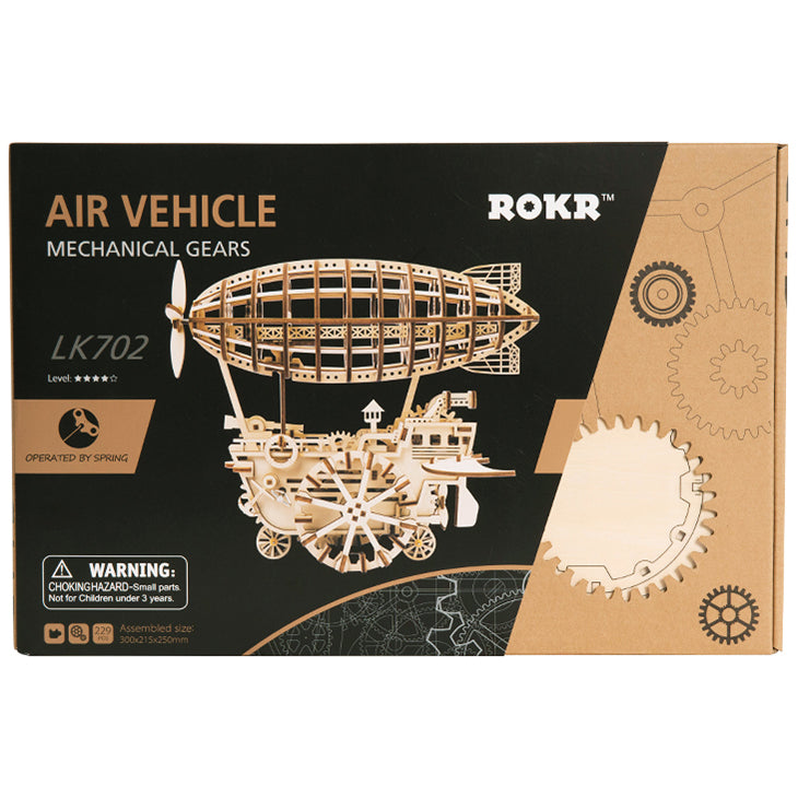 Voorkant verpakking van de Robotime Air Vehicle, houten modelbouw van een mechansche, rijdende steampunk zeppelin