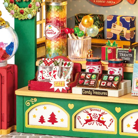 Details van de spulletjes op de toonbank van de Robotime Christmas Candy Stand