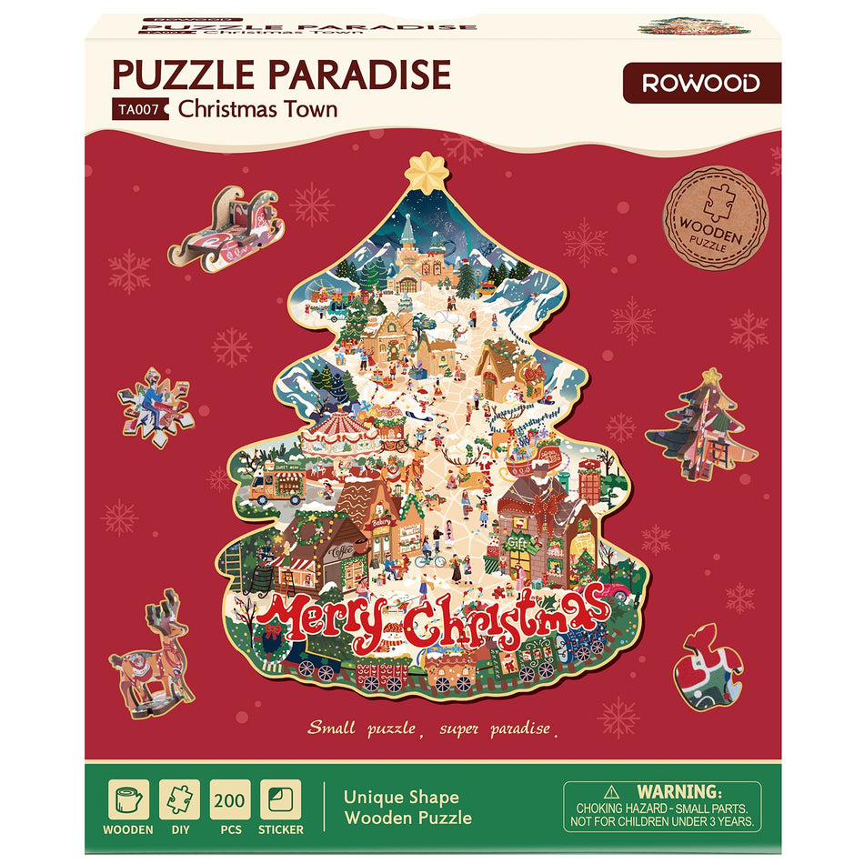 Voorkant verpakking van de Robotime Christmas Town, kerstboom legpuzzel met bijzondere stukjes, met daarop afgebeeld een dorp in kerstsfeer
