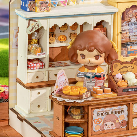 Cookii achter de toonbank van de Robotime Cookii Bunny’s Cookie Shop