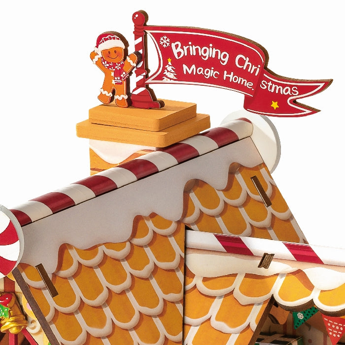 Close-up van de vlag en een peperkoekenmannetje in de Robotime Gingerbread House