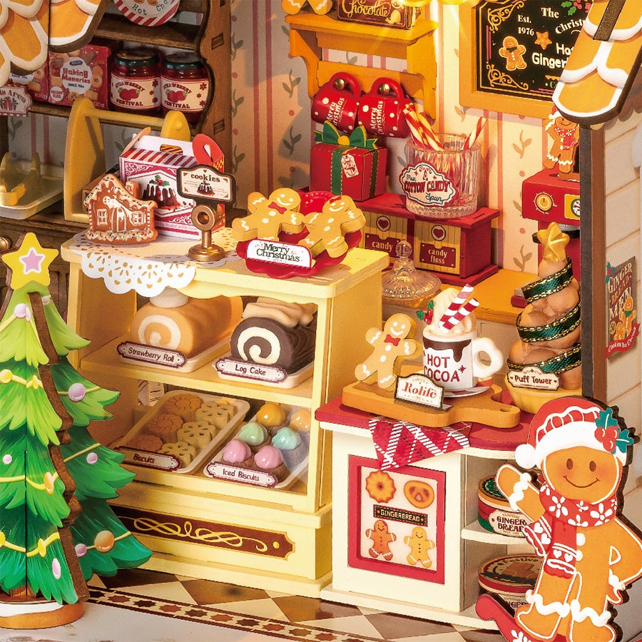 Detail van de toonbank met typische kerstlekkernijen in de Robotime Gingerbread House