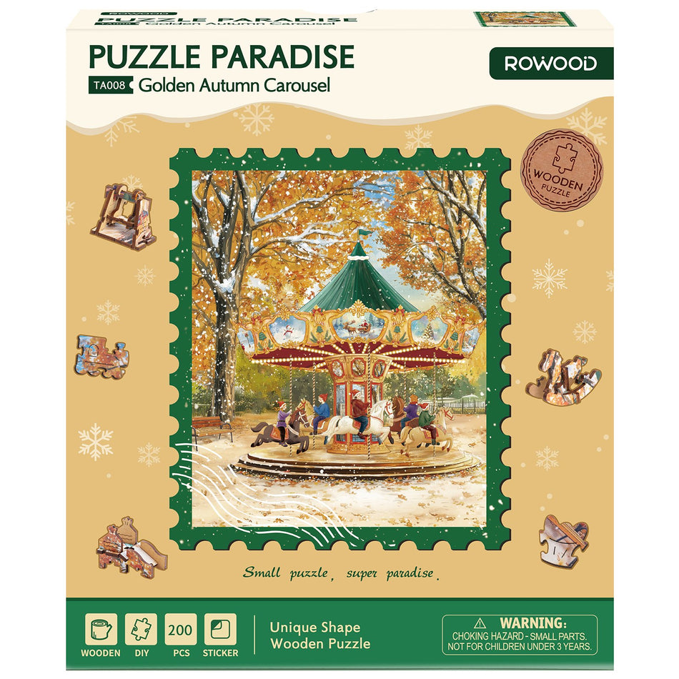 Voorkant verpakking van de Robotime Golden Autumn Carousel, legpuzzel met bijzondere stukjes, met daarop afgebeeld een ouderwetse carousel op een sneeuwachtige herfstdag