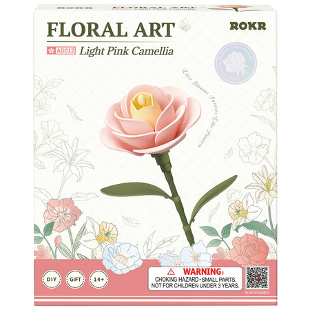 Voorkant verpakking van de Robotime Light Pink Camellia, kunststof bouwpakket van een lichtroze camellia