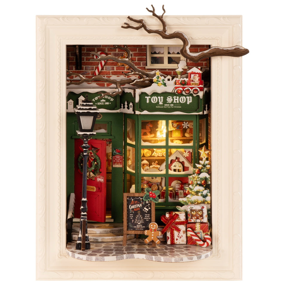Productfoto van de Robotime Santa’s Toy Shop, diorama van een in kerstthema versierd winkeltje met lichtjes