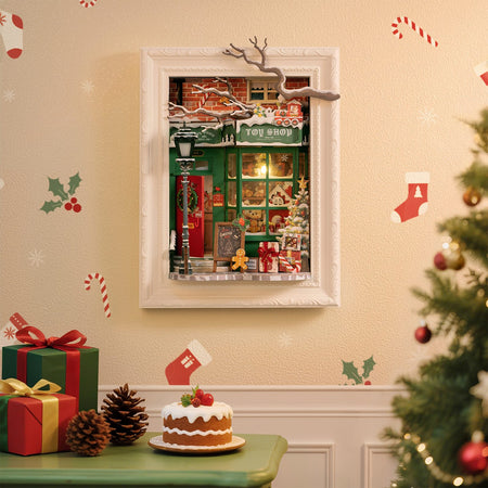 Sfeervolle presentatie van de Robotime Santa’s Toy Shop, diorama van een in kerstthema versierd winkeltje met lichtjes