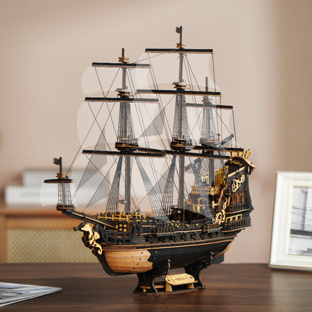 Sfeervolle presentatie van de Robotime Seahorse Barque, zwart houten zeilschip met gouden details